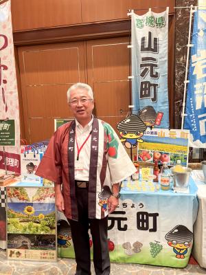 企業立地セミナーで対応する橋元町長